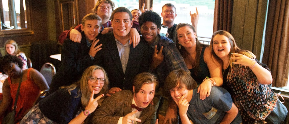 Students pose for a group photo at Calhouns restaurant